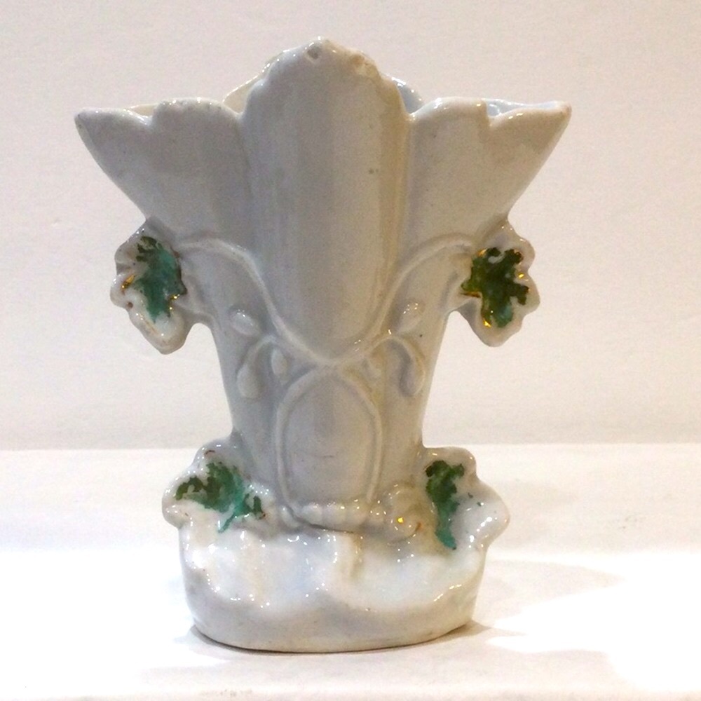 Antique spill vase decorated bas relief flowers vines